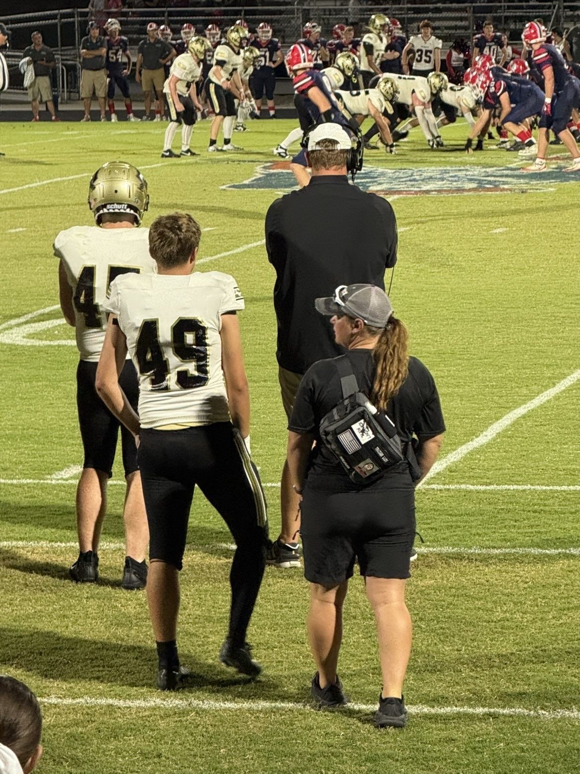 JSOH athletic trainer working the sideline during a varsity football game
